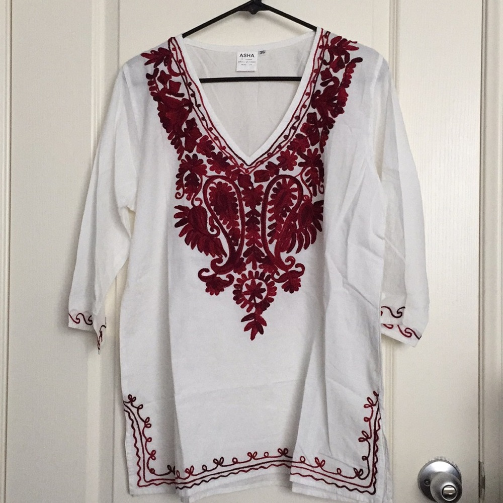 White and red embroidered detail blouse.